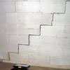 A diagonal stair step crack along the foundation wall of a Peachtree City home